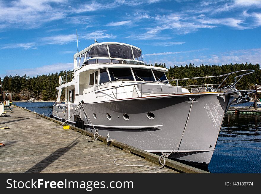 Large grey yacht sitting at a dock on Salt Spring Island. Large grey yacht sitting at a dock on Salt Spring Island