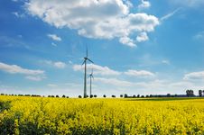 Wind Turbines Among Rapeseed Fields And Mead Royalty Free Stock Photos Wind Turbines Among Rapeseed Fields And Mead Royalty Free Stock Photos