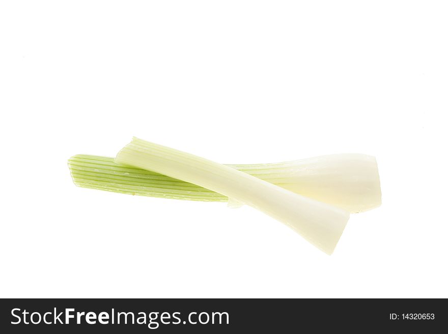 Two salad onions isolated on white
