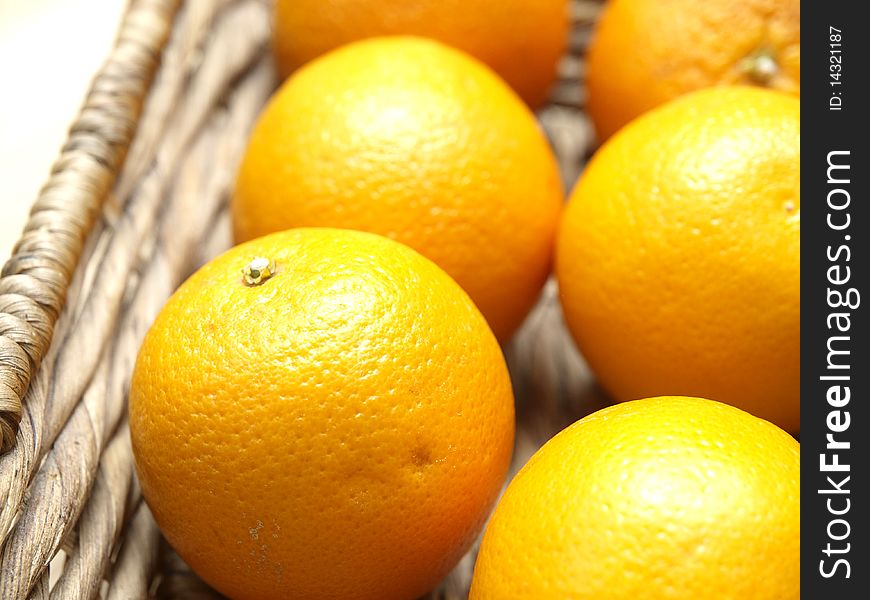 Some oranges in a basket