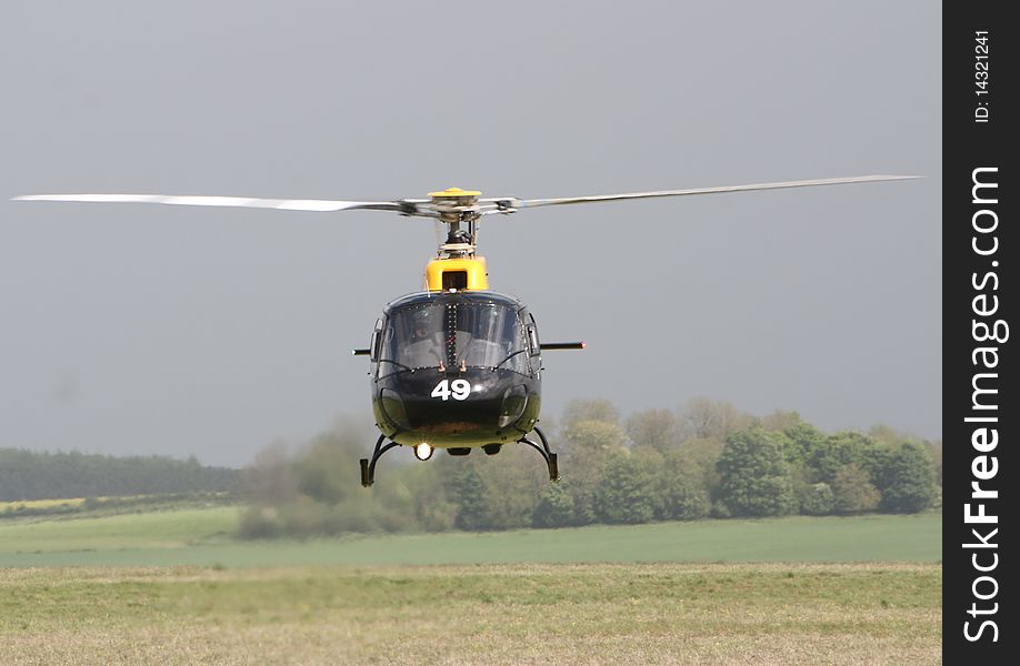 A squirrel helicopter against a field on Salisbury Plain. A squirrel helicopter against a field on Salisbury Plain