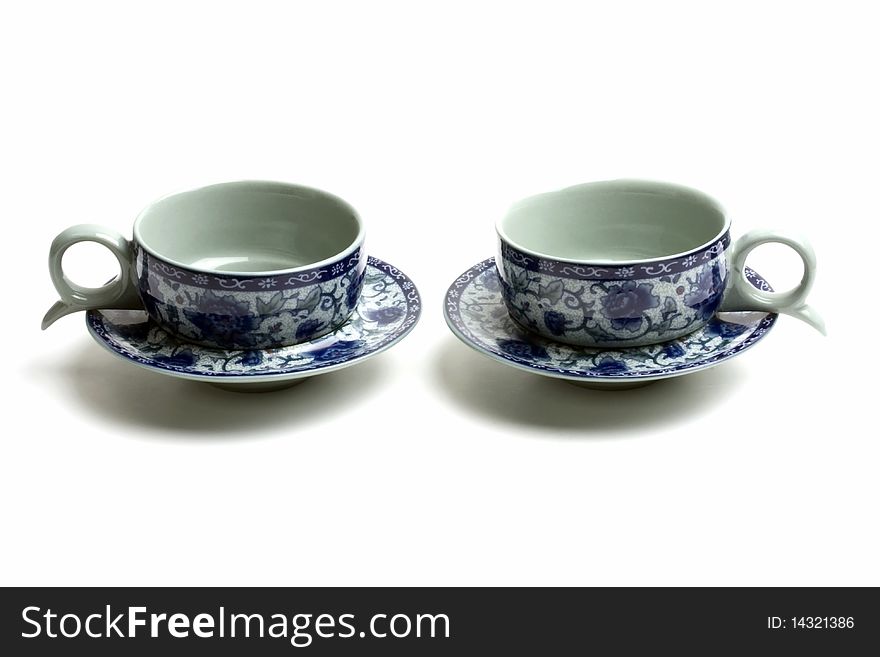 A pair of tea cups isolated on white background