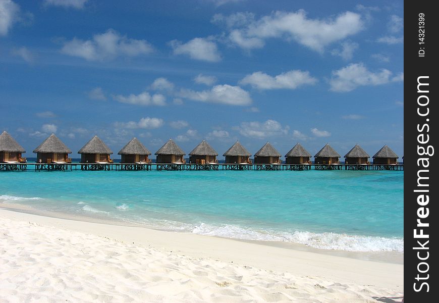 Water bungalow on the sea with amazing beach and sky. Water bungalow on the sea with amazing beach and sky.