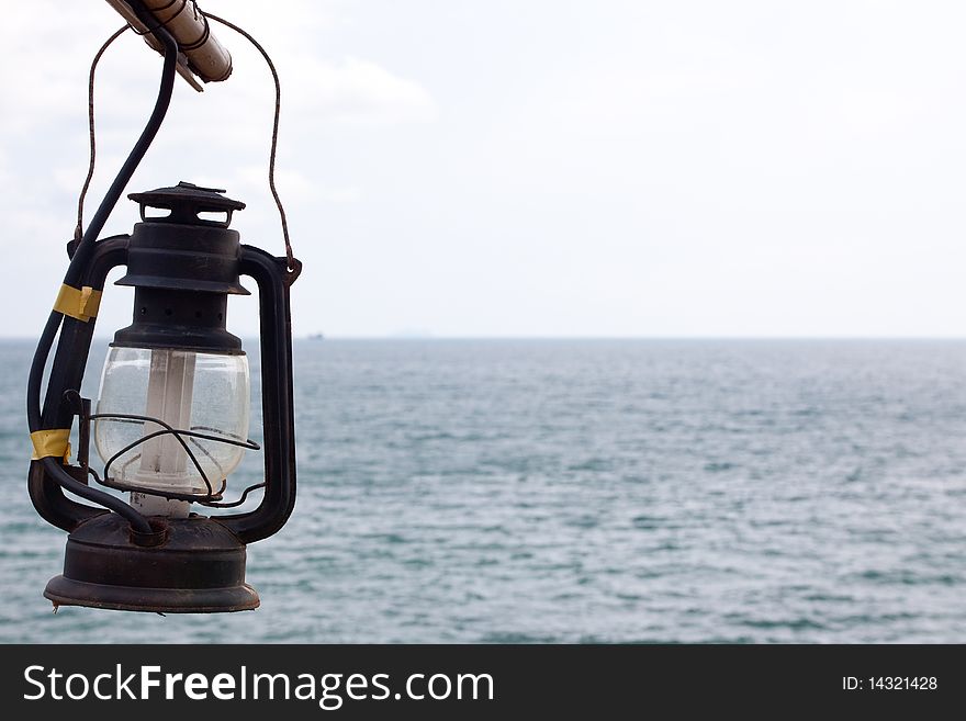 Vintage lamp isolated on the sea. close up. Vintage lamp isolated on the sea. close up.