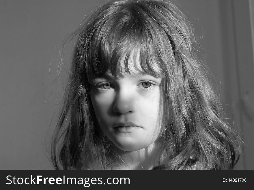 Black-and-white portrait of the girl woken up in the morning shined with solar beams. Black-and-white portrait of the girl woken up in the morning shined with solar beams