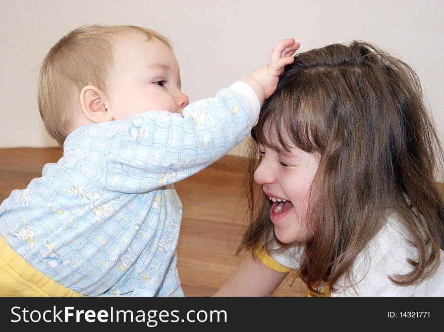 The little boy suffices for hair the sister which has closed eyes and has opened a mouth. The little boy suffices for hair the sister which has closed eyes and has opened a mouth