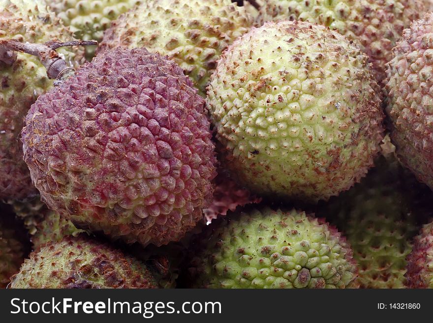 Close-up of fresh and tasty litchis background. Produced fruit in southern China.