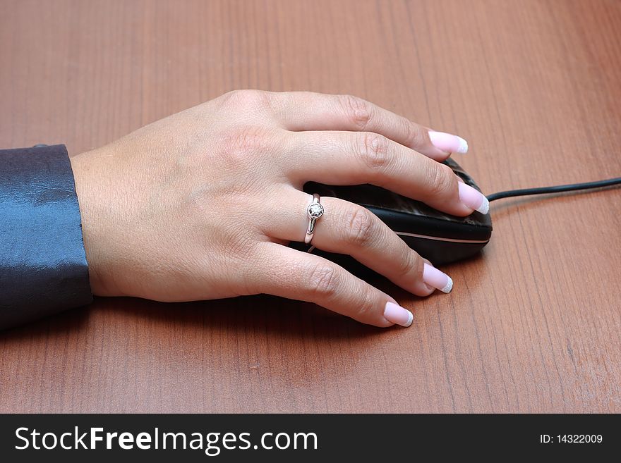 Woman's hand on computer mouse