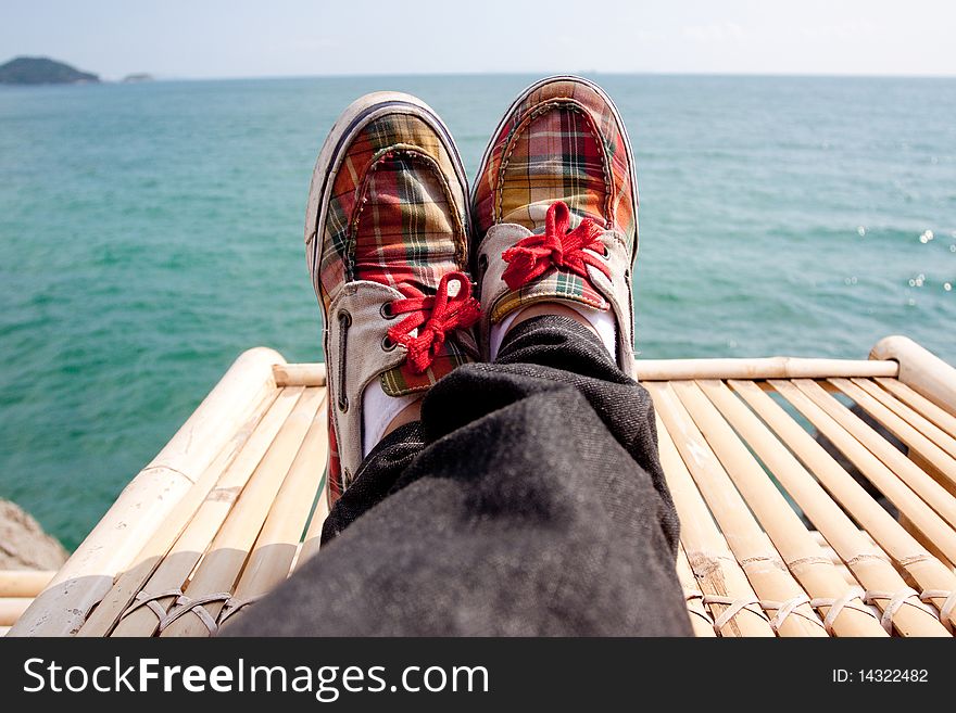 Retro styled sneakers in the sea. Retro styled sneakers in the sea.