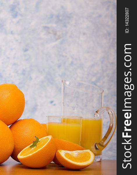 Oranges and jug of orange juice. Oranges and jug of orange juice