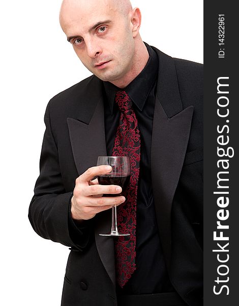 Young business man in dark suit holding a glass of wine. Young business man in dark suit holding a glass of wine