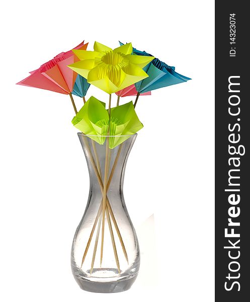 Origami flowers in glass vase