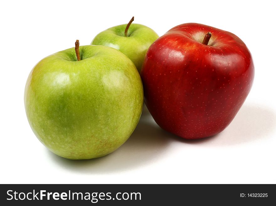 Shiny green and red apples isolated over white background. Shiny green and red apples isolated over white background.