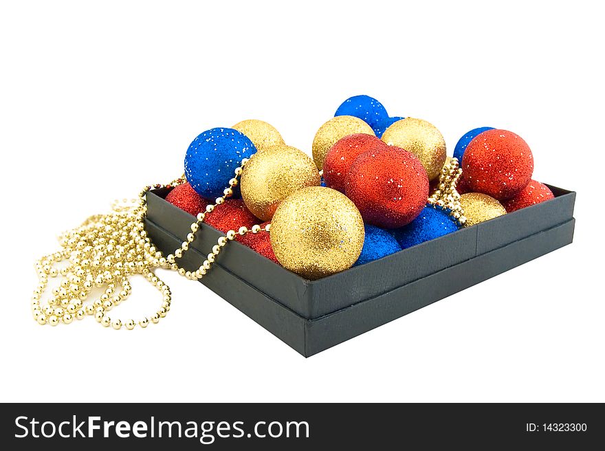 Set of blue,red and gold Christmas balls in a black box. Set of blue,red and gold Christmas balls in a black box