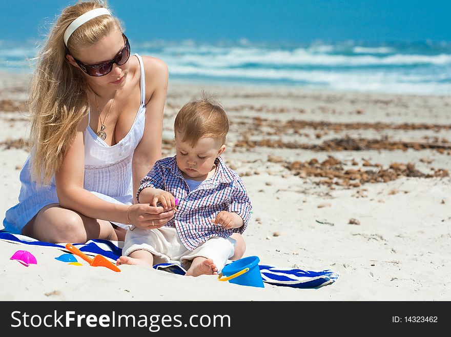 Child and mother on a beach. Child and mother on a beach