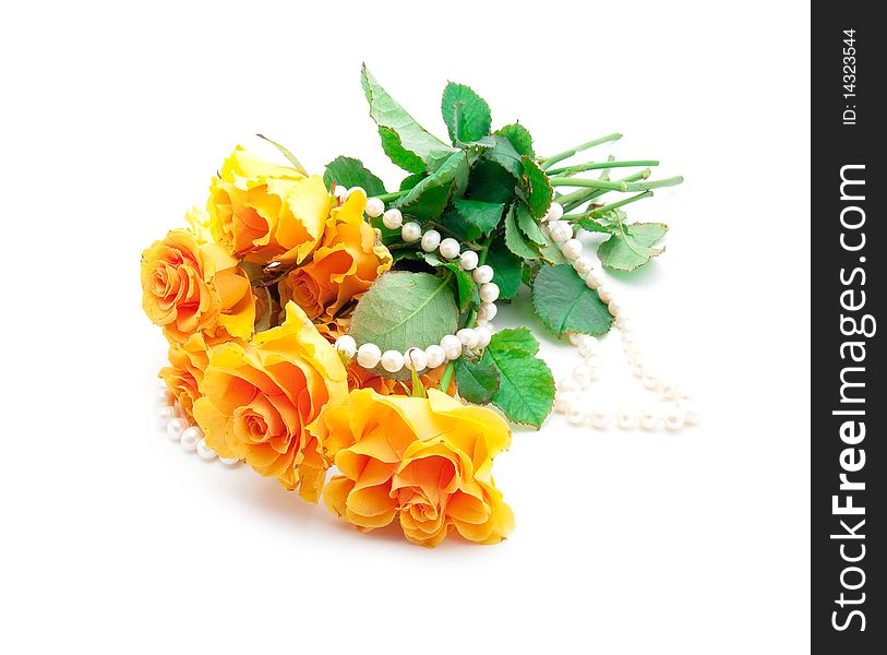 Bouquet of orange roses with a pearl necklace