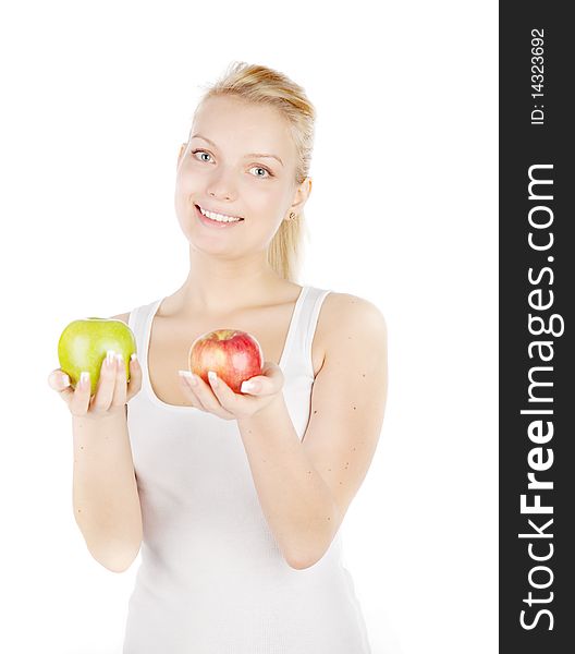 Young blonde with apple isolated on white. Focus on girl`s eyes. Young blonde with apple isolated on white. Focus on girl`s eyes.