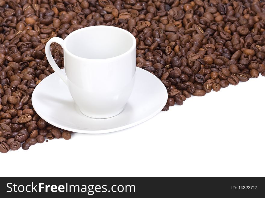 Coffee beans and empty cup