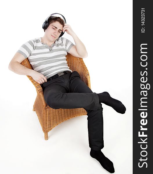 Young man is relaxing on armchair