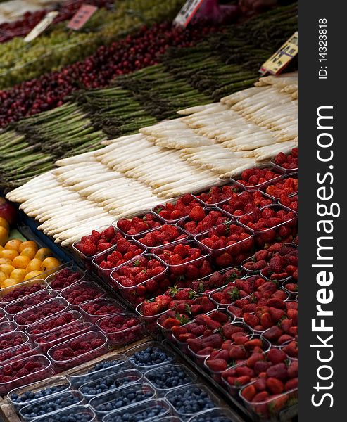 A stall at a street market selling fruits and vegetables