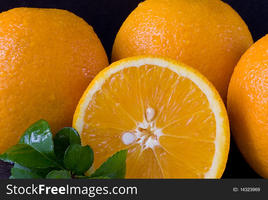 A group of oranges with leaf and slice. A group of oranges with leaf and slice