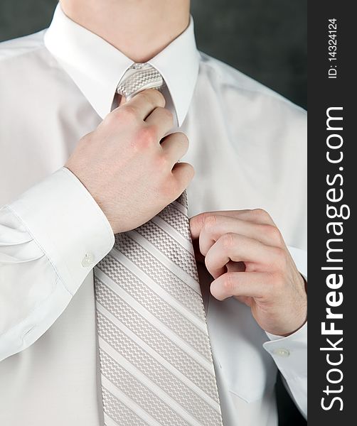 Businessman Is Adjusting His Tie