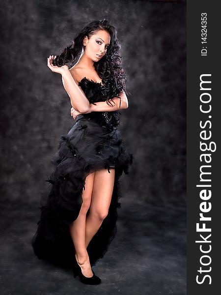 Glamorous woman with black dress and beautiful hai