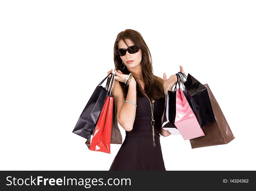 Brunette woman with sun glasses and lots of shopping bags. Brunette woman with sun glasses and lots of shopping bags