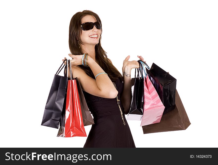 Brunette woman with sun glasses and lots of shopping bags. Brunette woman with sun glasses and lots of shopping bags