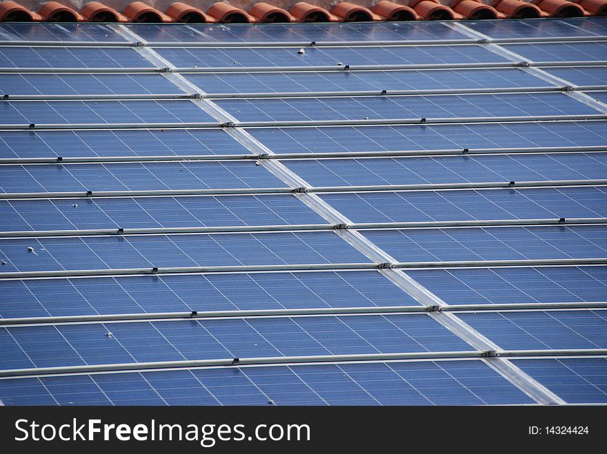 Solar panels on top of roof of an old house