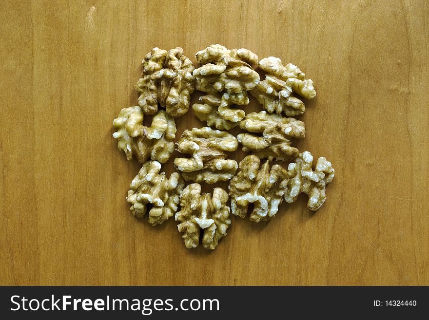 Shelled walnuts on a wooden board