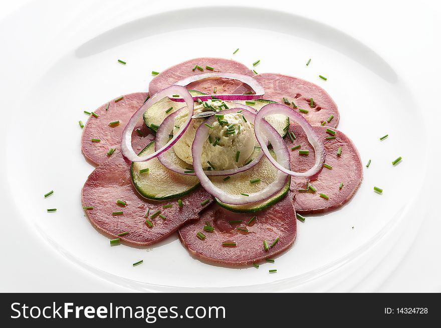 Slices of marinated beef tongue