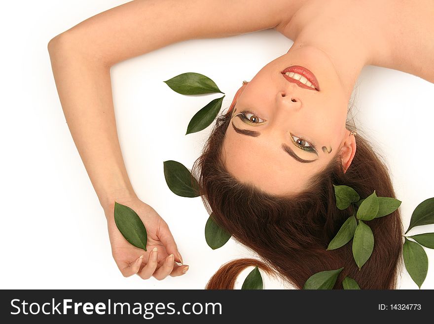 Beautiful young woman with green leaves. Beautiful young woman with green leaves