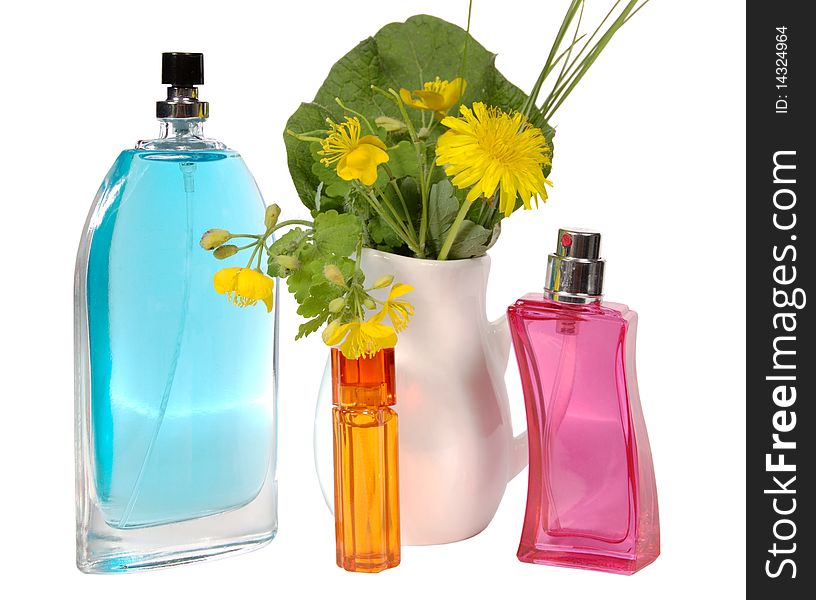 Bottles of female perfumery and bouquet dandelions