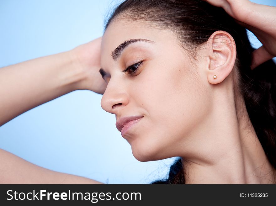 Portrait of young woman on blue background. Portrait of young woman on blue background