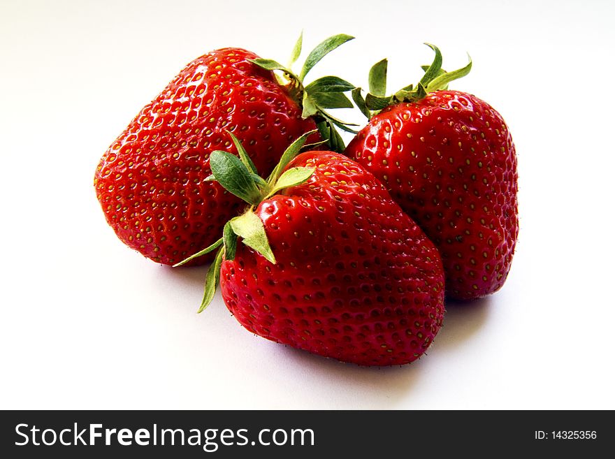 Ripe strawberries on a white background. Ripe strawberries on a white background