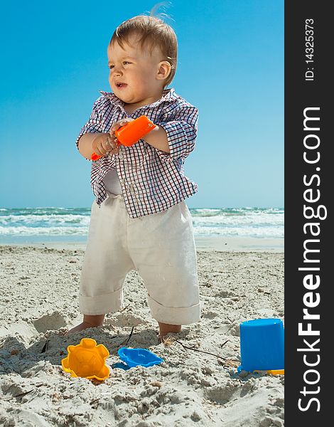 Child playing on a beach. Child playing on a beach