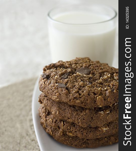 Oatmeal chocolate chip cookies with a glass of milk. Oatmeal chocolate chip cookies with a glass of milk.