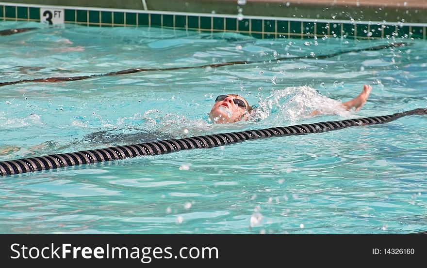 Young Boy /Backstroke in Pool