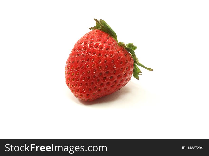 A single strawberry on a white background. A single strawberry on a white background.