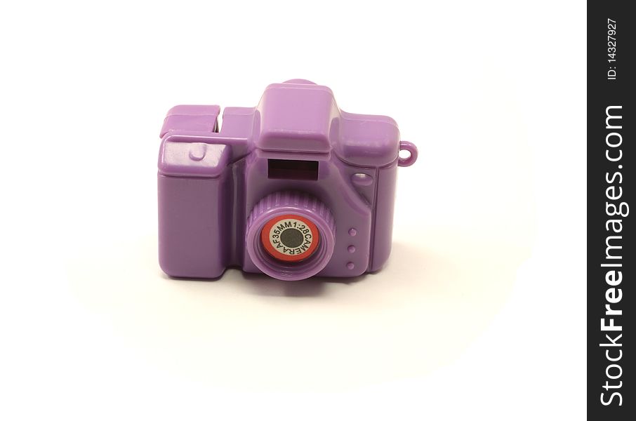 A purple toy 35mm camera on a white background. A purple toy 35mm camera on a white background.