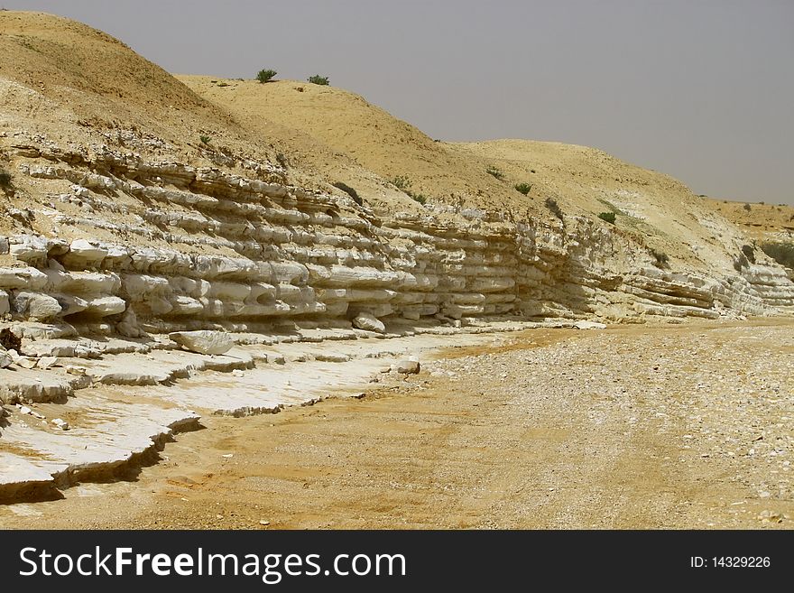 Stone layers in a desert river uncovered by the flood. Stone layers in a desert river uncovered by the flood.