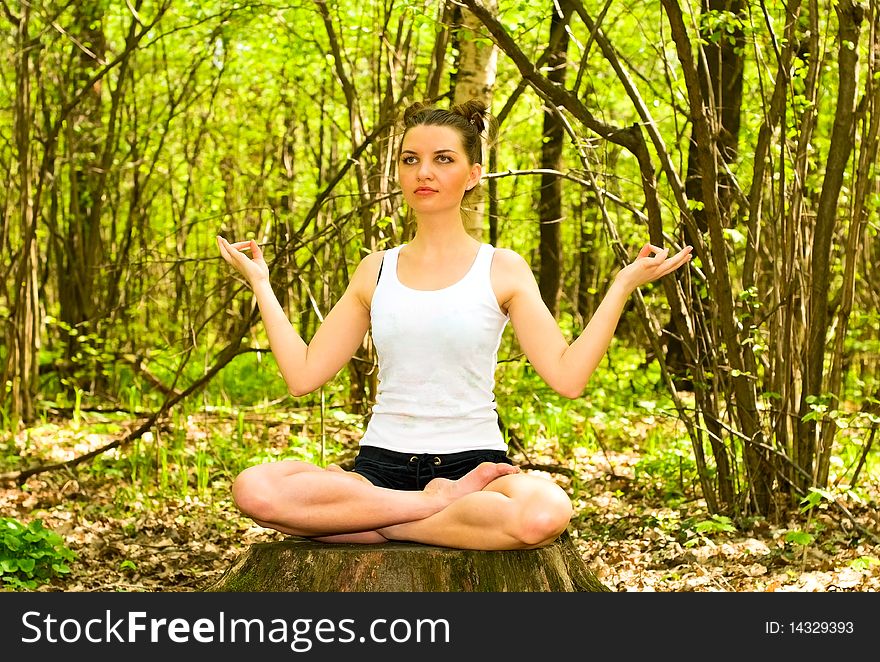 Young woman in meditation pose. Young woman in meditation pose