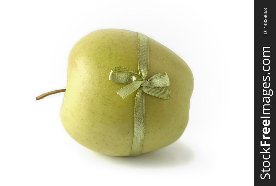Ripe apple bandaged satin ribbon on a white background