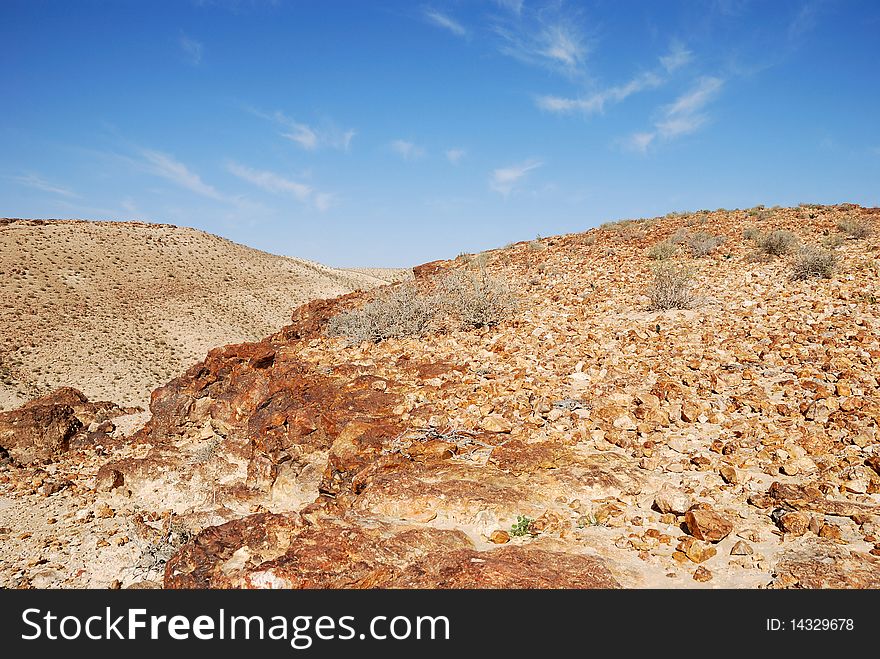 Ancient rocks under blue sky. Desert Negev, Israel.