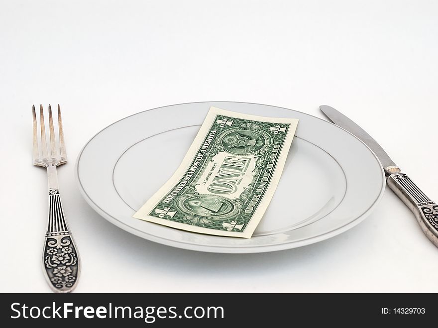 Dinner service with dollar denomination on plate. Dinner service with dollar denomination on plate.