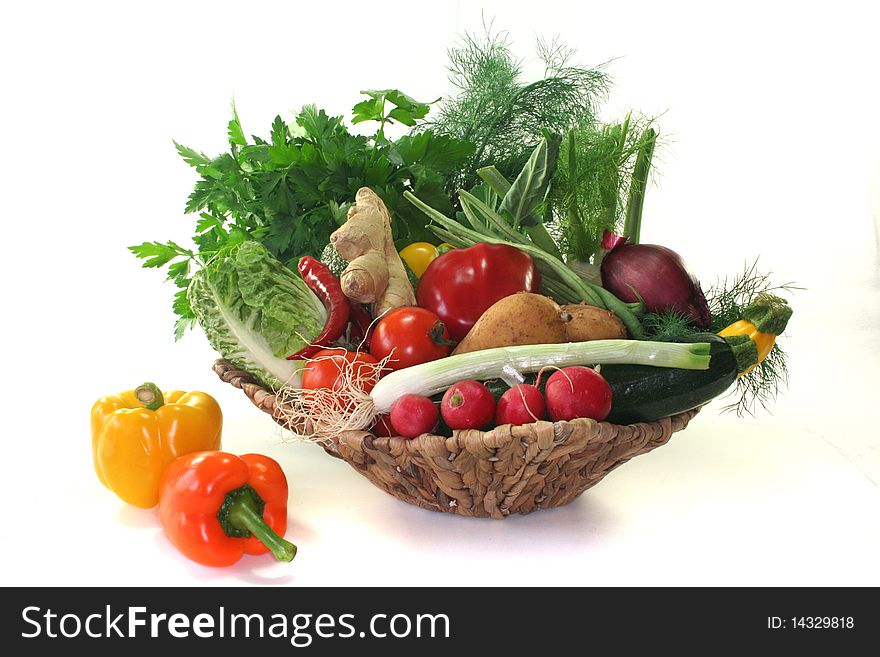 Colorful mix of many different fresh vegetables in a basket. Colorful mix of many different fresh vegetables in a basket