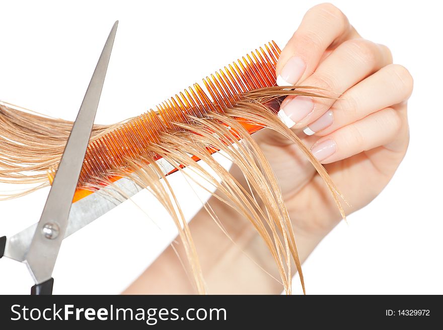 Woman cutting hair close-up on white isolated background