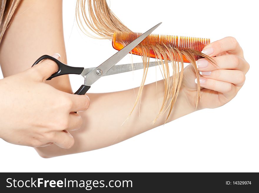 Woman cutting hair close-up on white isolated background