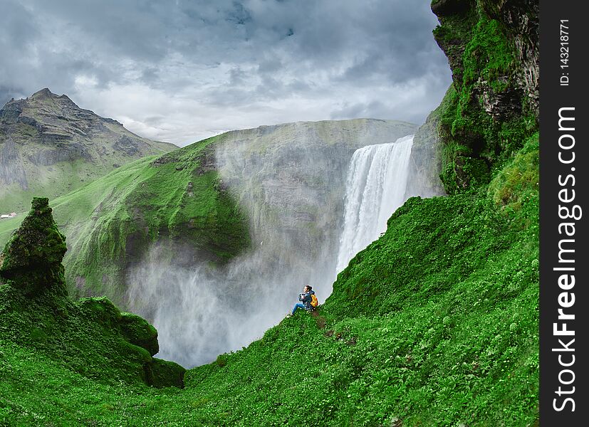 Cheerful woman walking and posing on nature in Iceland